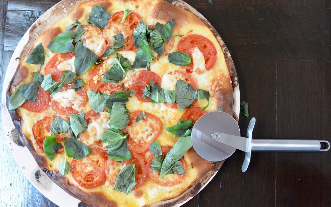 Pizza with Garlic, Tomato, Mozzarella and Basil